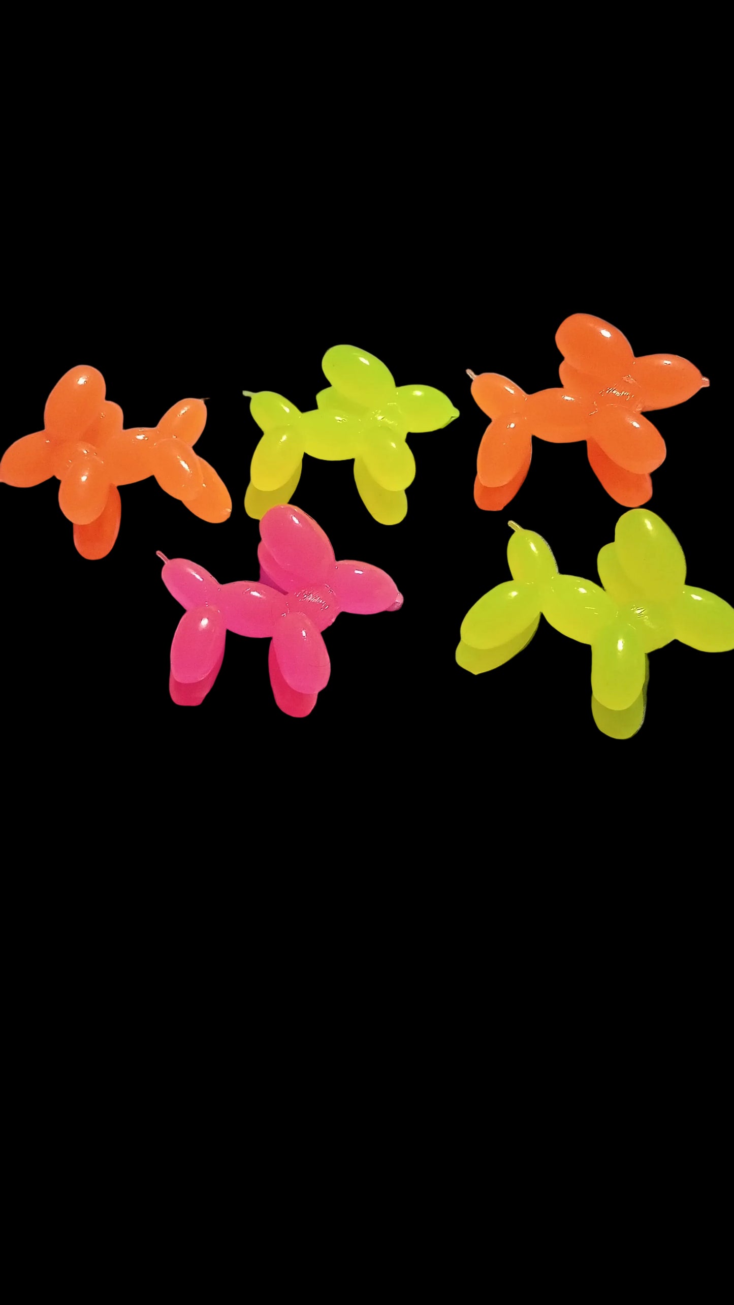 Colorful balloon animals on a bed