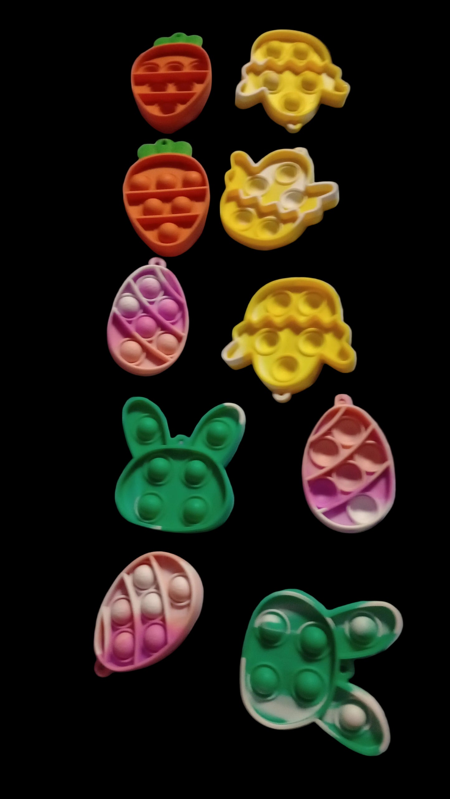 Colorful pop-it fidget toys on a light blue fabric background