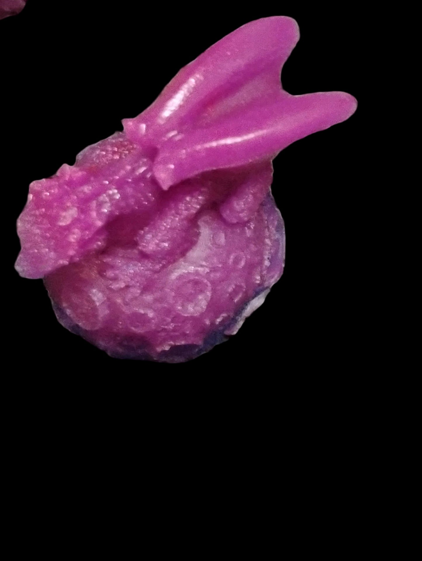 Resin dragon sitting on moon