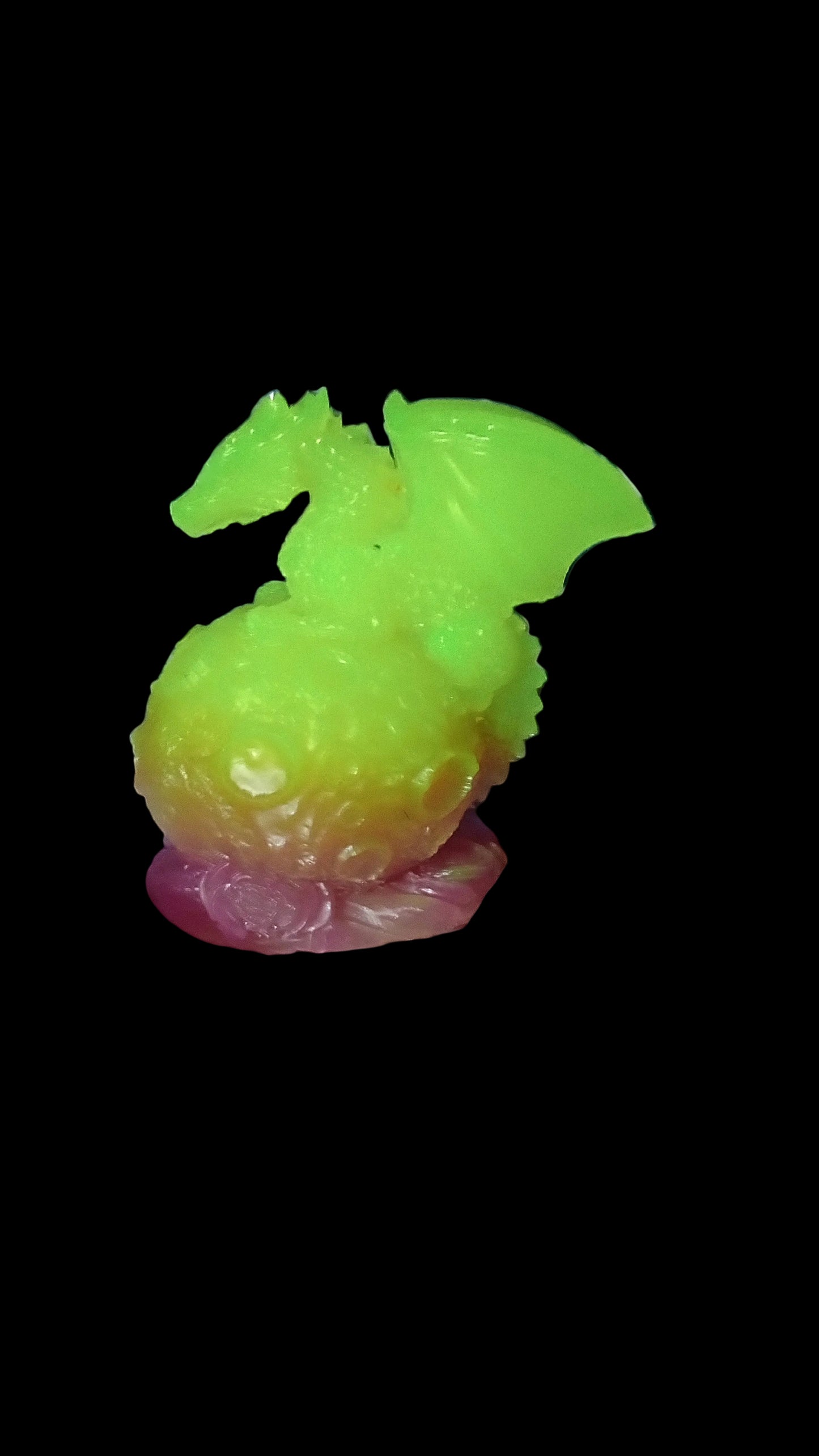 Resin dragon sitting on moon