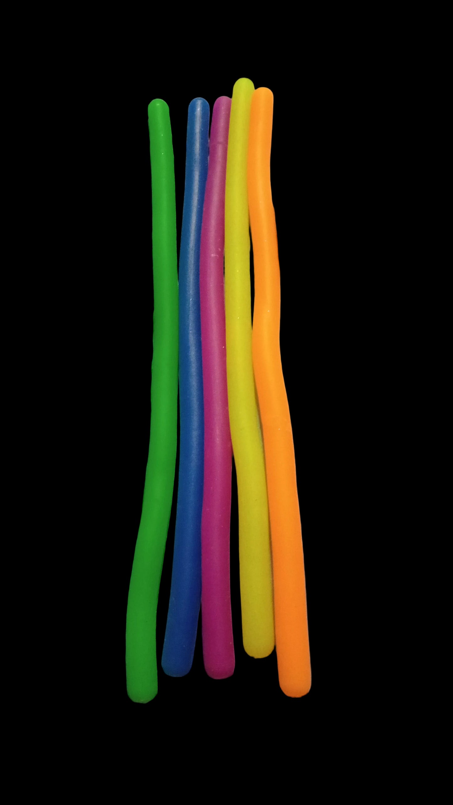 Colorful sticks on a white fabric background
